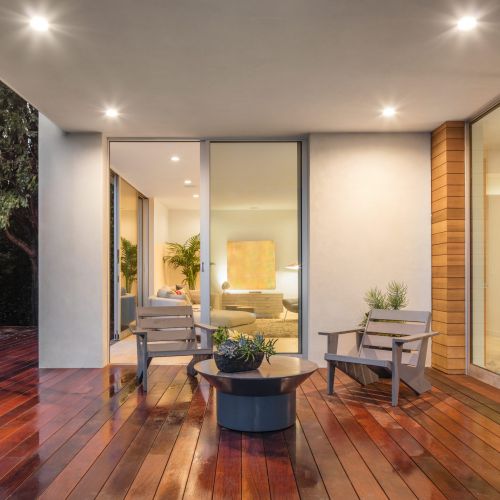 Wooden,Deck,/,Balcony,At,Night,With,Furniture,And,Open